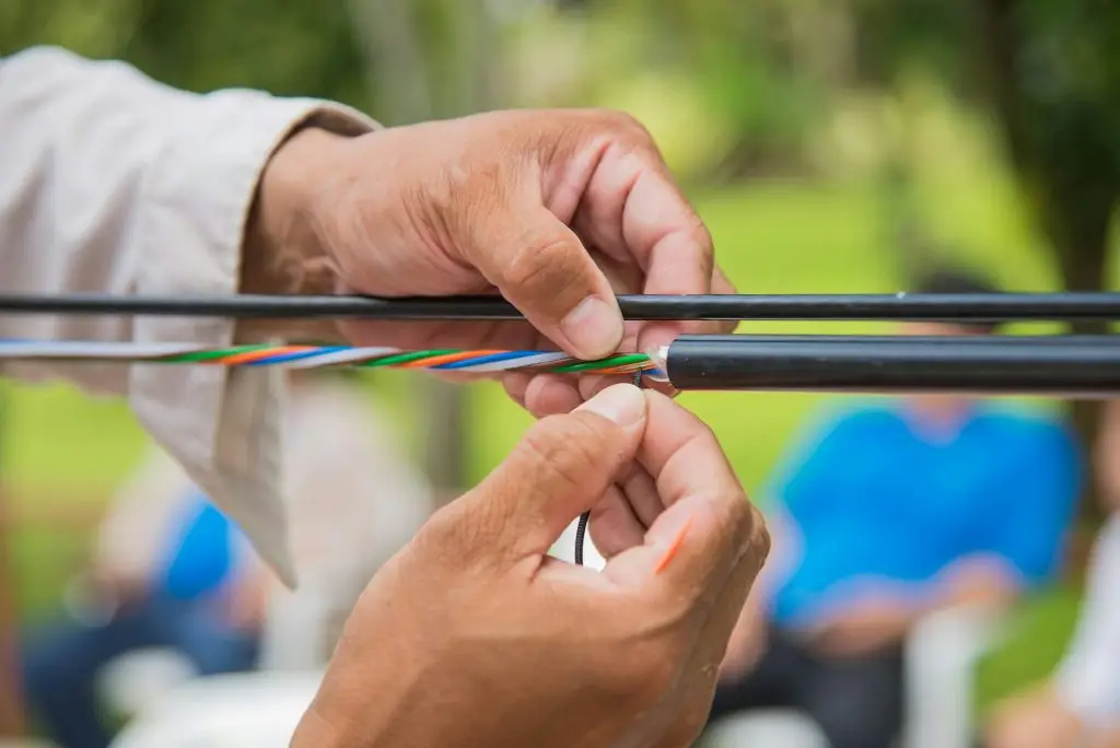 Technicians are installing optic fiber.